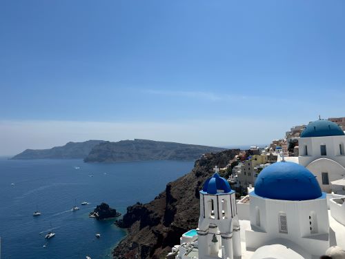 Santorini with blue domes and sea