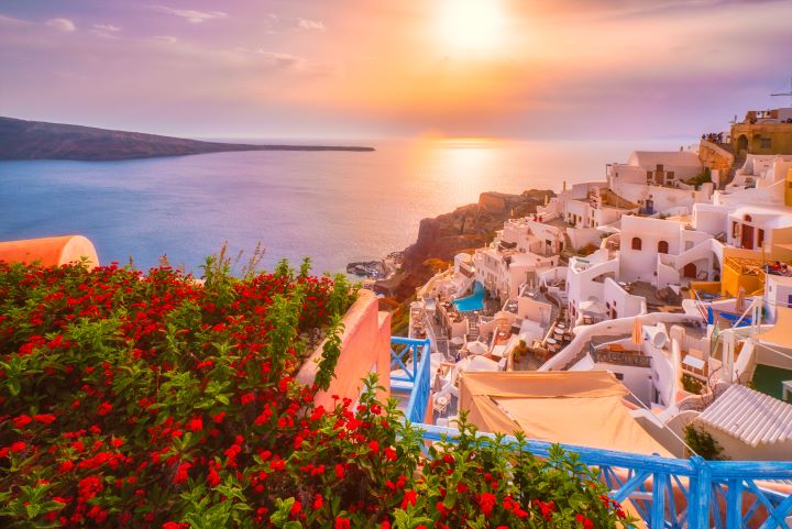 a view of a city and a body of water Santorini Sunset