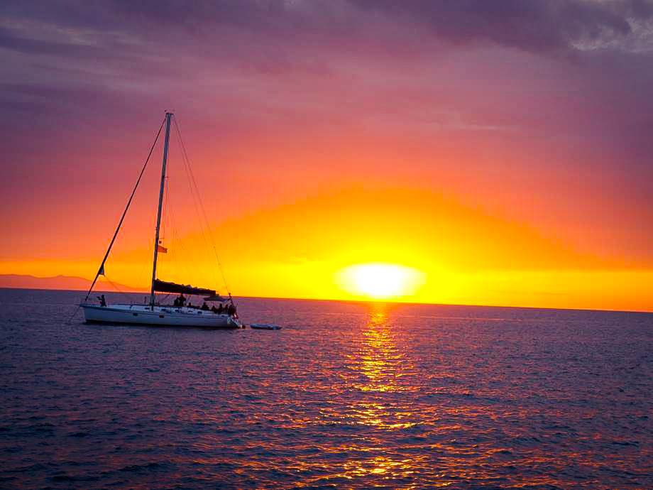 Santorini Catamaran in Aegean Sea at sunset