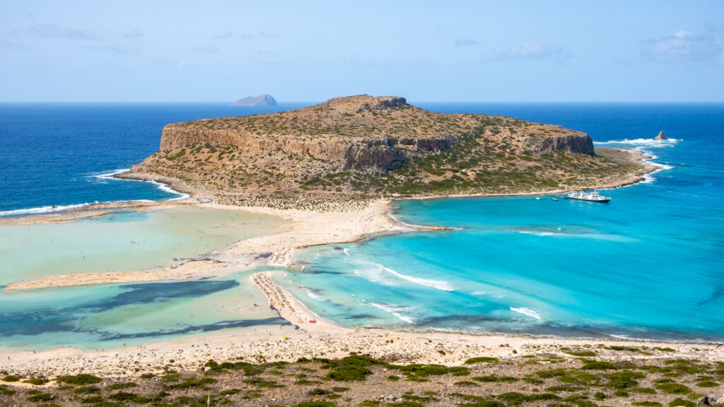 Beaches in Chania Crete Greece, Balos lagoon on Crete island, Greece. Tourists relax at the crystal clear ocean of Balos Beach. Greece on a sunny day in summer