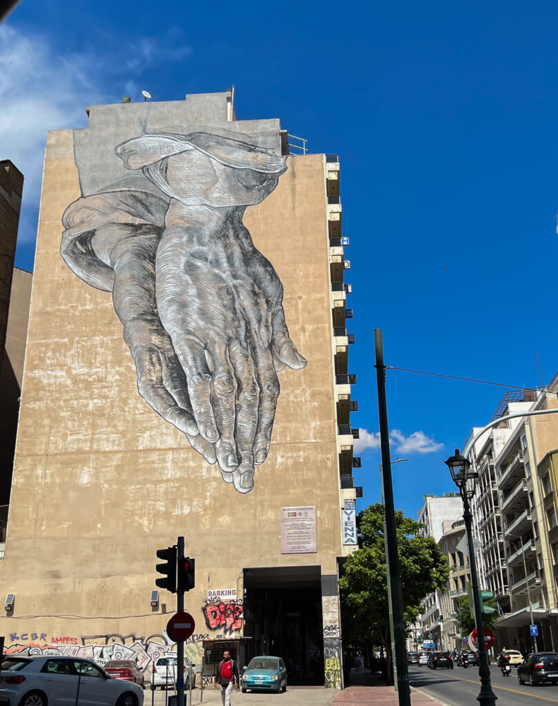 Is Athens safe? "Hands" graffiti mural in Omonia