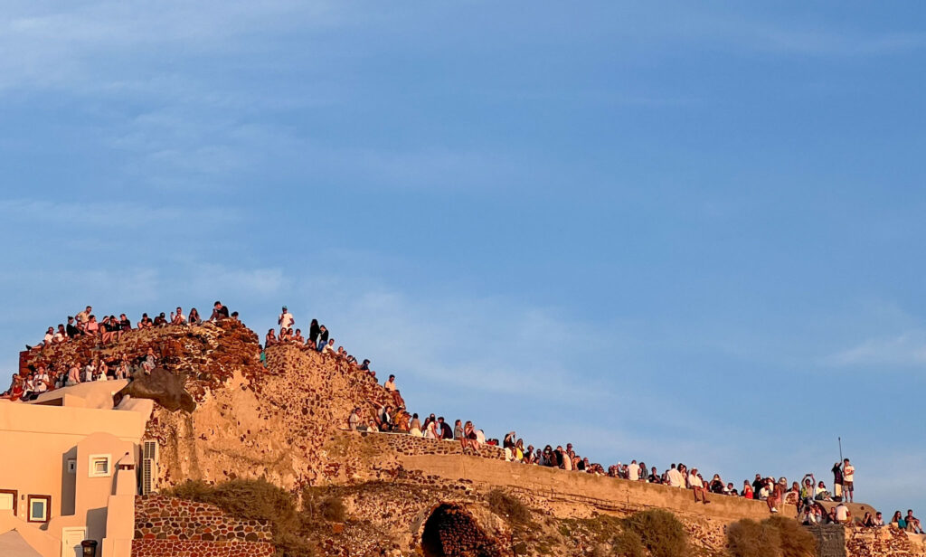 a group of people on a stone wall
